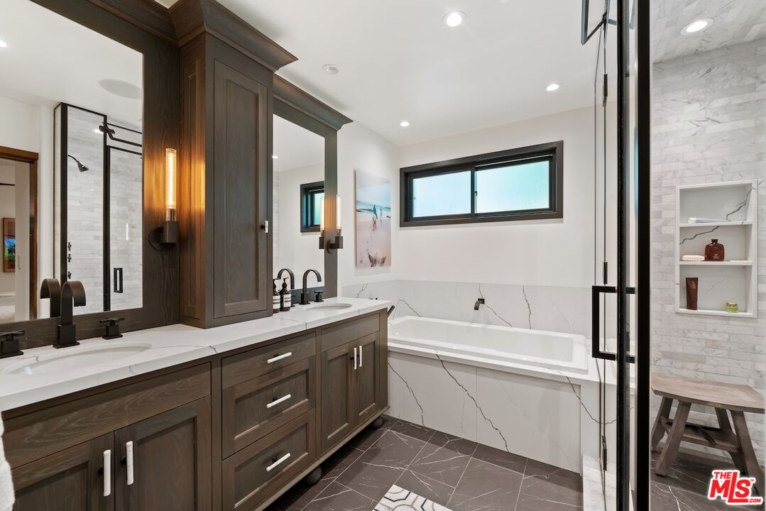 2612 Montana Avenue, Unit 1 Santa Monica, CA 90403 - Photo 16 of 27 a spacious bathroom with a granite countertop sink mirror and bathtub