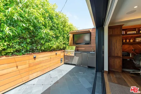 a view of a room with a flat screen tv