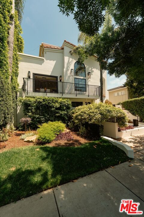2612 Montana Avenue, Unit 1 Santa Monica, CA 90403 - Photo 26 of 27 a front view of a house with a yard