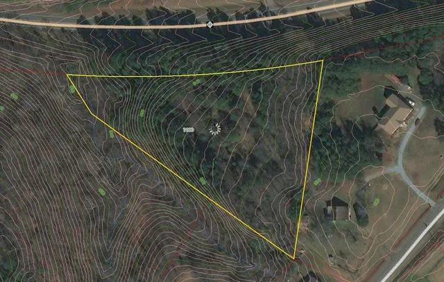 a view of swimming pool with a yard and green space