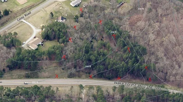 a view of a yard with a tree