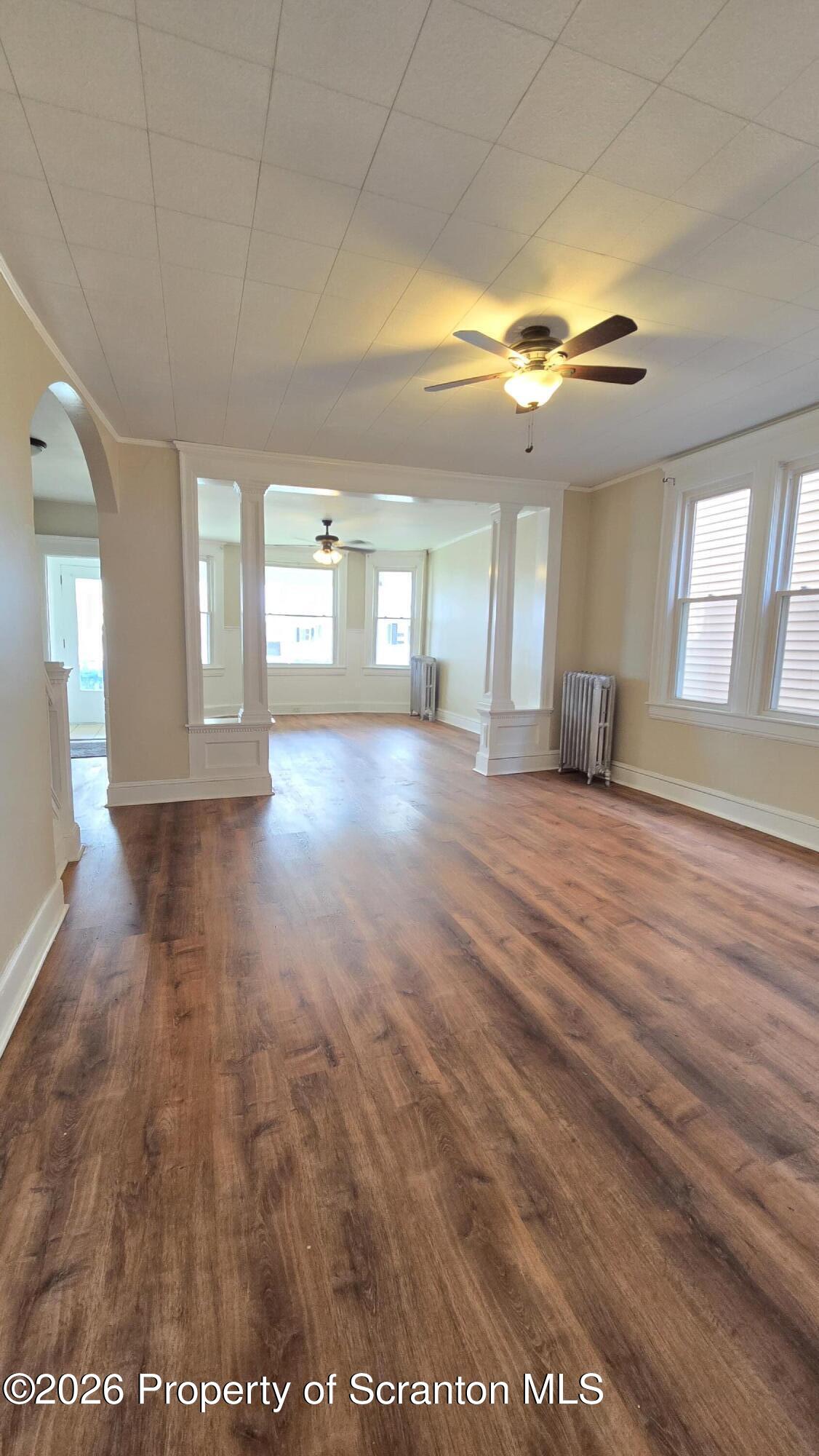 543 North Sumner Avenue Scranton, PA 18504 - Photo 4 of 16 a view of an empty room with window and wooden floor