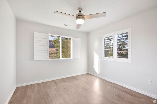1440 West 100 South Virgin, UT 84779 - Photo 23 of 45 Spacious room featuring wood-finish flooring and light-toned walls