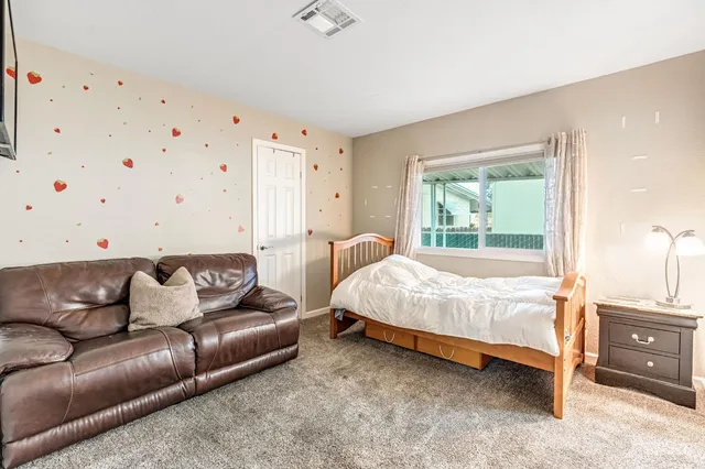 a bed room with a bed and a couch