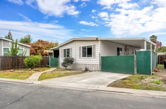 a view of a house with basketball court
