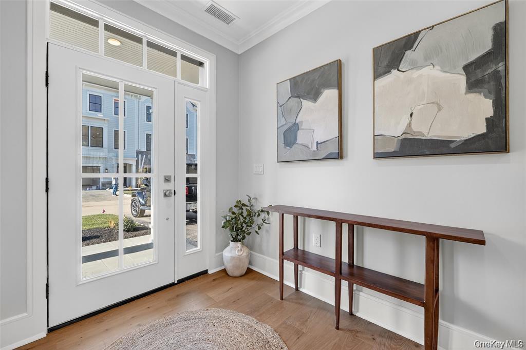 1828 Soundview Court Yorktown Heights, NY 10598 - Photo 2 of 39 a view of a hallway with wooden floor and entryway