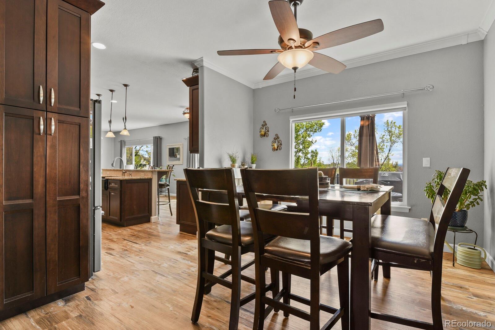 21018 Saddleback Circle Parker, CO 80138 - Photo 15 of 50 a view of a dining room with furniture