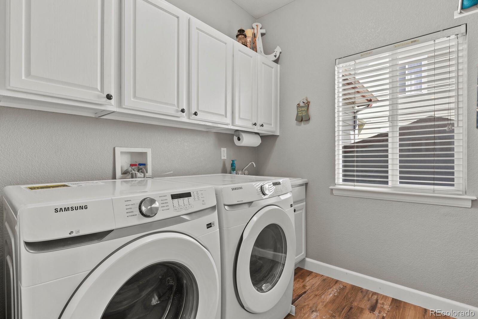 21018 Saddleback Circle Parker, CO 80138 - Photo 20 of 50 a utility room with dryer and washer