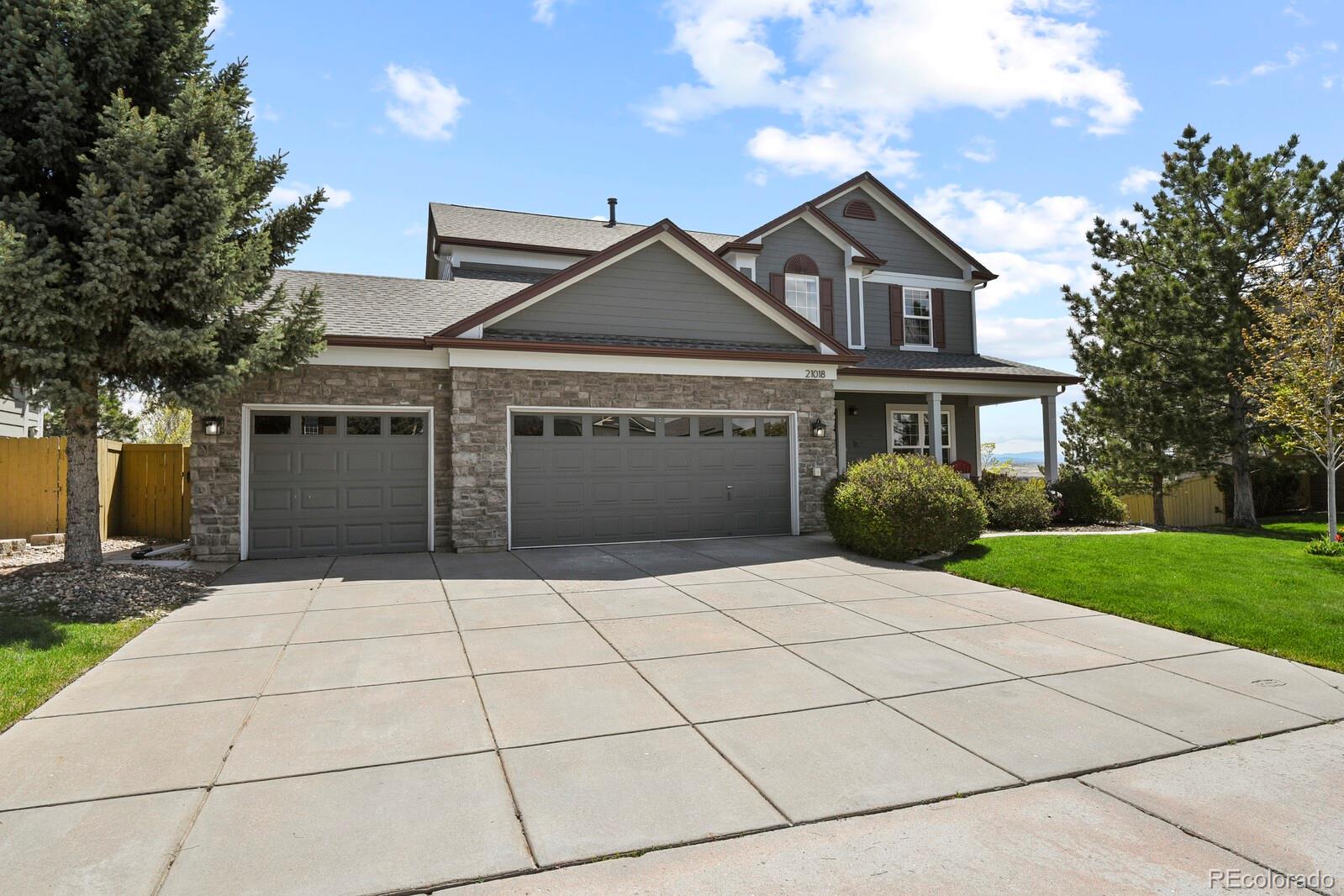 21018 Saddleback Circle Parker, CO 80138 - Photo 2 of 50 a front view of a house with yard