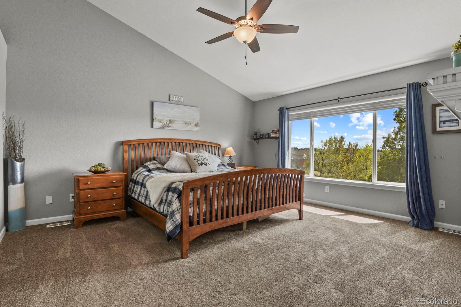 21018 Saddleback Circle Parker, CO 80138 - Photo 22 of 50 a bedroom with a bed and window