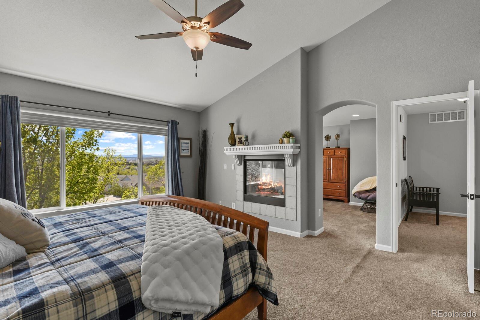 21018 Saddleback Circle Parker, CO 80138 - Photo 23 of 50 a bed room with a bed and a window