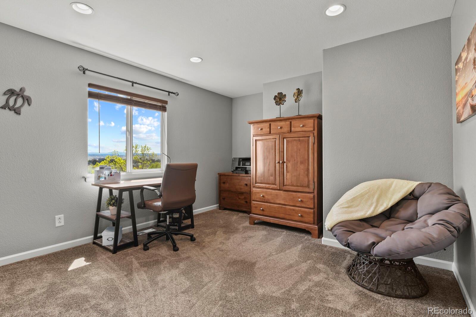 21018 Saddleback Circle Parker, CO 80138 - Photo 24 of 50 a workspace with furniture and window