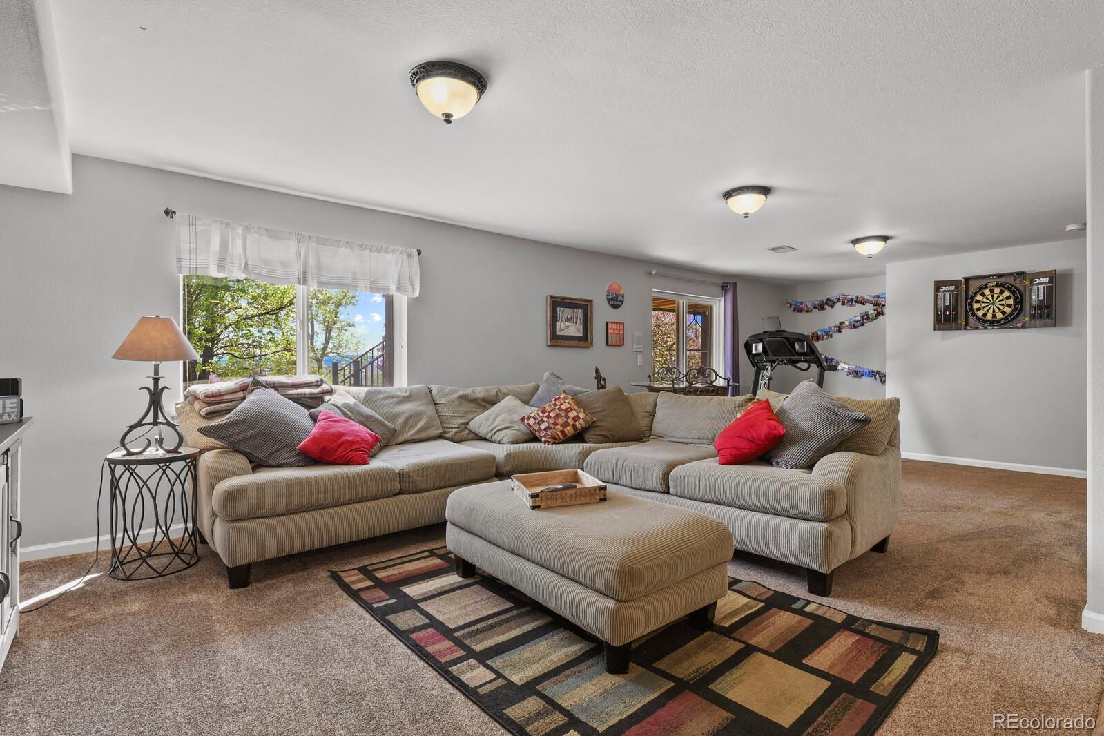 21018 Saddleback Circle Parker, CO 80138 - Photo 33 of 50 a living room with furniture and a rug