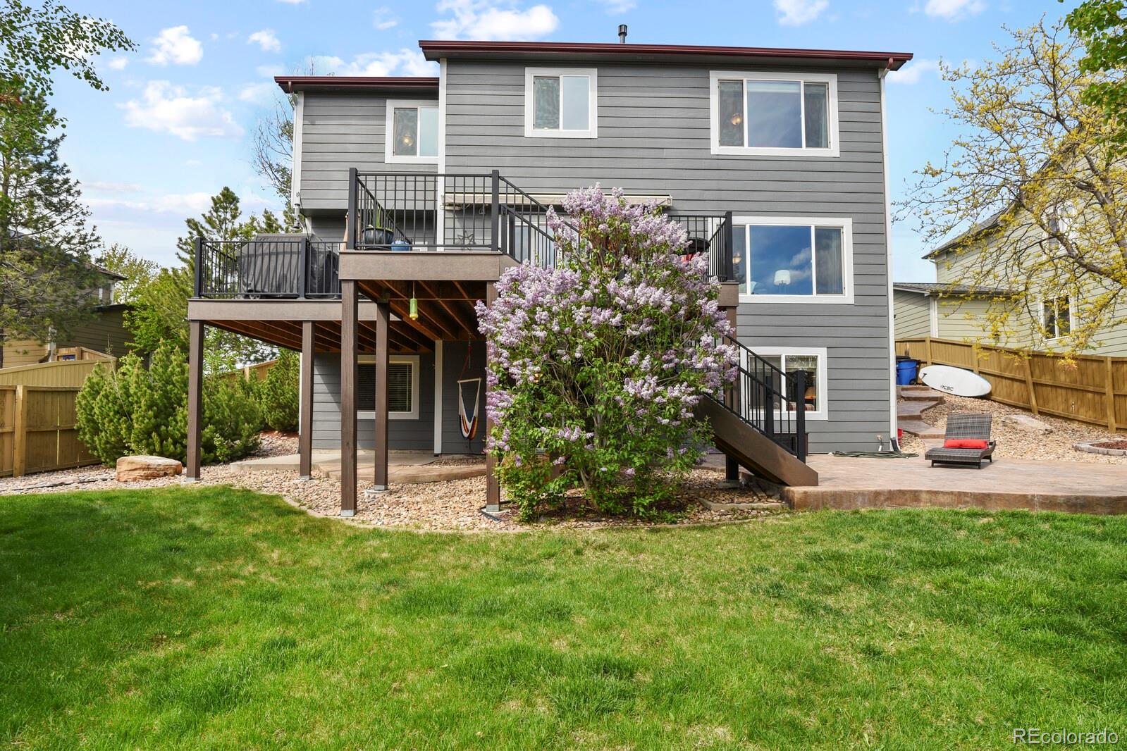 21018 Saddleback Circle Parker, CO 80138 - Photo 46 of 50 a view of a house with a yard and sitting area