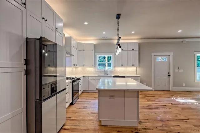 a bathroom with a double vanity sink and mirror
