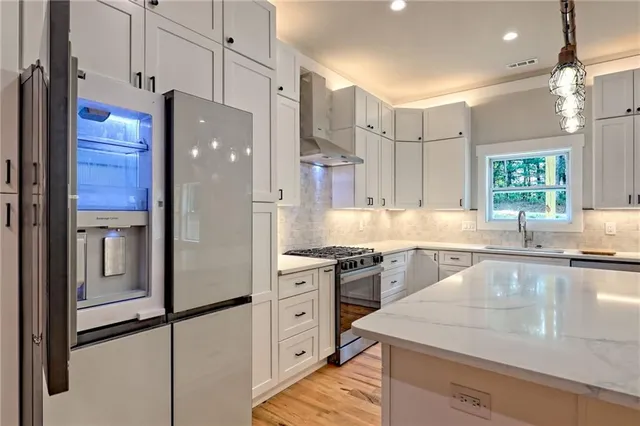 a bathroom with a double vanity sink a mirror and a shower