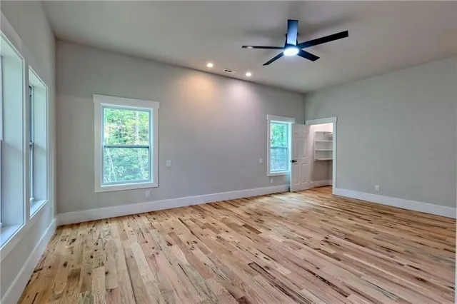 a view of balcony with wooden floor and fence