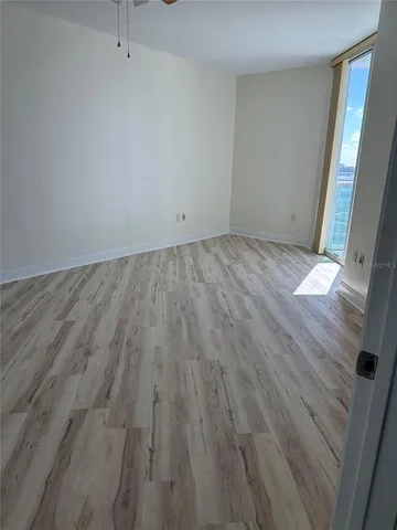 an empty room with wooden floor