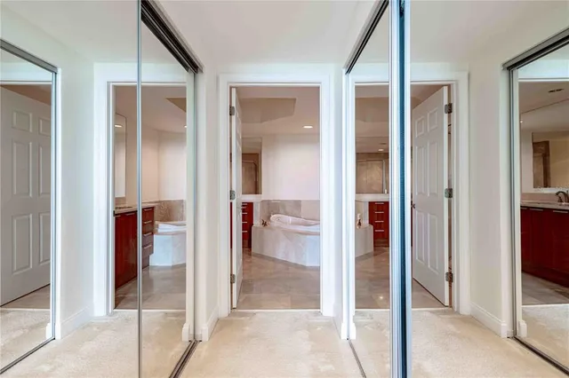 a view of a bathroom from a hallway