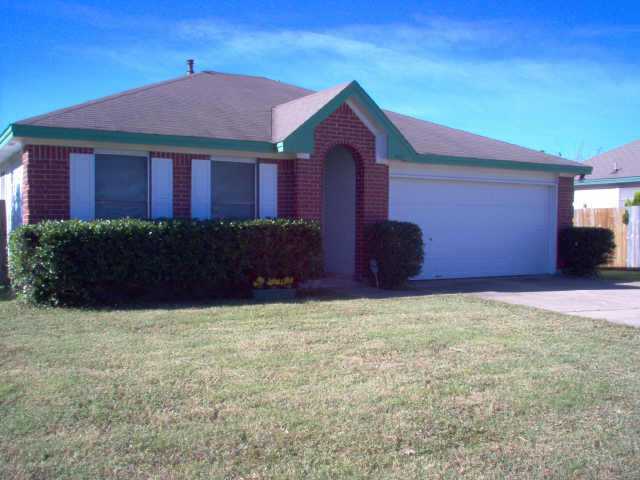 4507 Patsy Parkway Austin, TX 78744 - Photo 1 of 1 a front view of a house with a yard