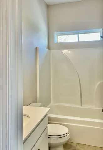 a view of cabinets and a window