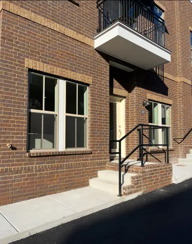 a kitchen with stainless steel appliances a refrigerator stove and microwave