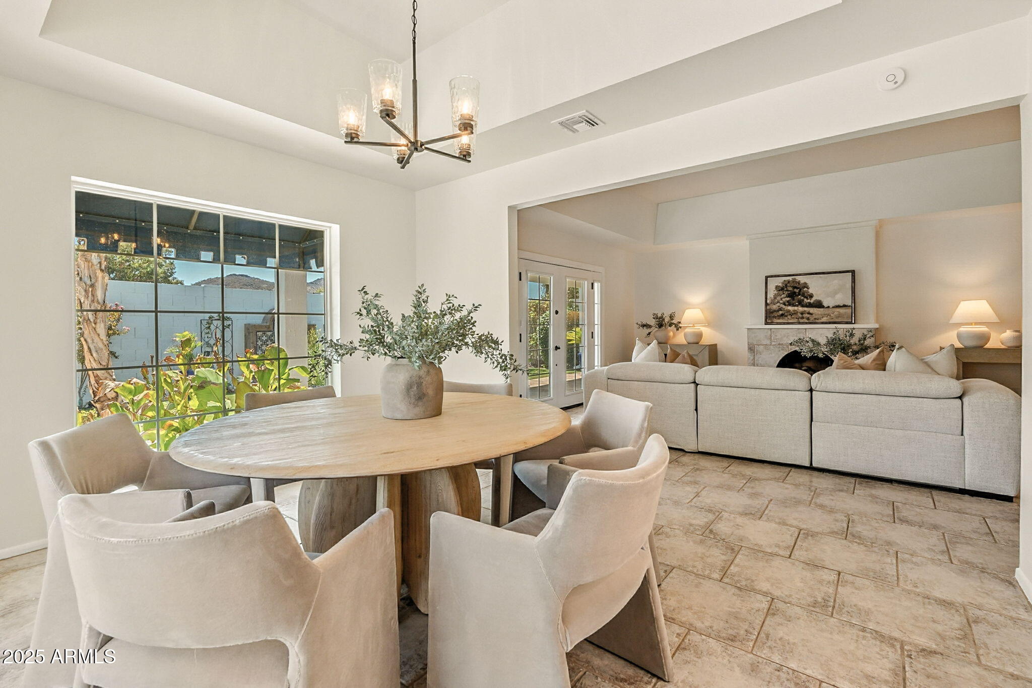 43 East Boca Raton Road Phoenix, AZ 85022 - Photo 17 of 99 a view of a dining room with furniture and a chandelier