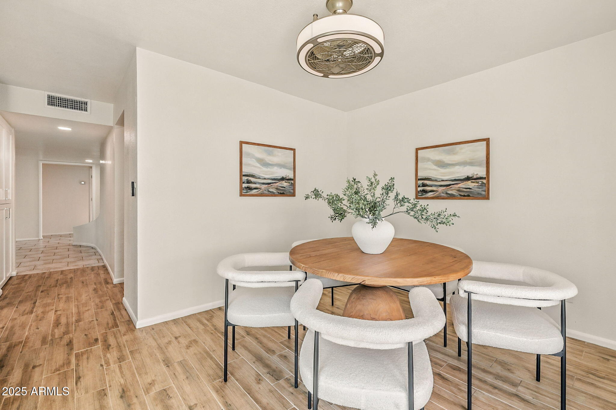 43 East Boca Raton Road Phoenix, AZ 85022 - Photo 22 of 99 a view of a dining room with furniture and wooden floor