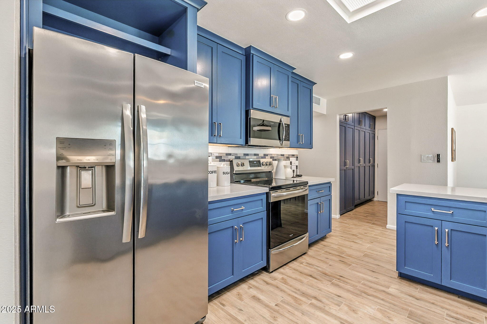 43 East Boca Raton Road Phoenix, AZ 85022 - Photo 25 of 99 a large kitchen with stainless steel appliances granite countertop a refrigerator and a sink