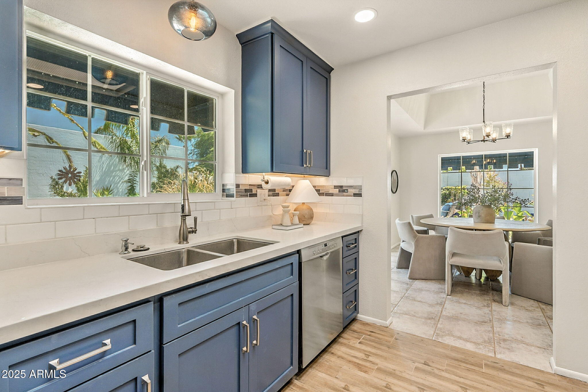43 East Boca Raton Road Phoenix, AZ 85022 - Photo 26 of 99 a kitchen with a sink and wooden cabinets