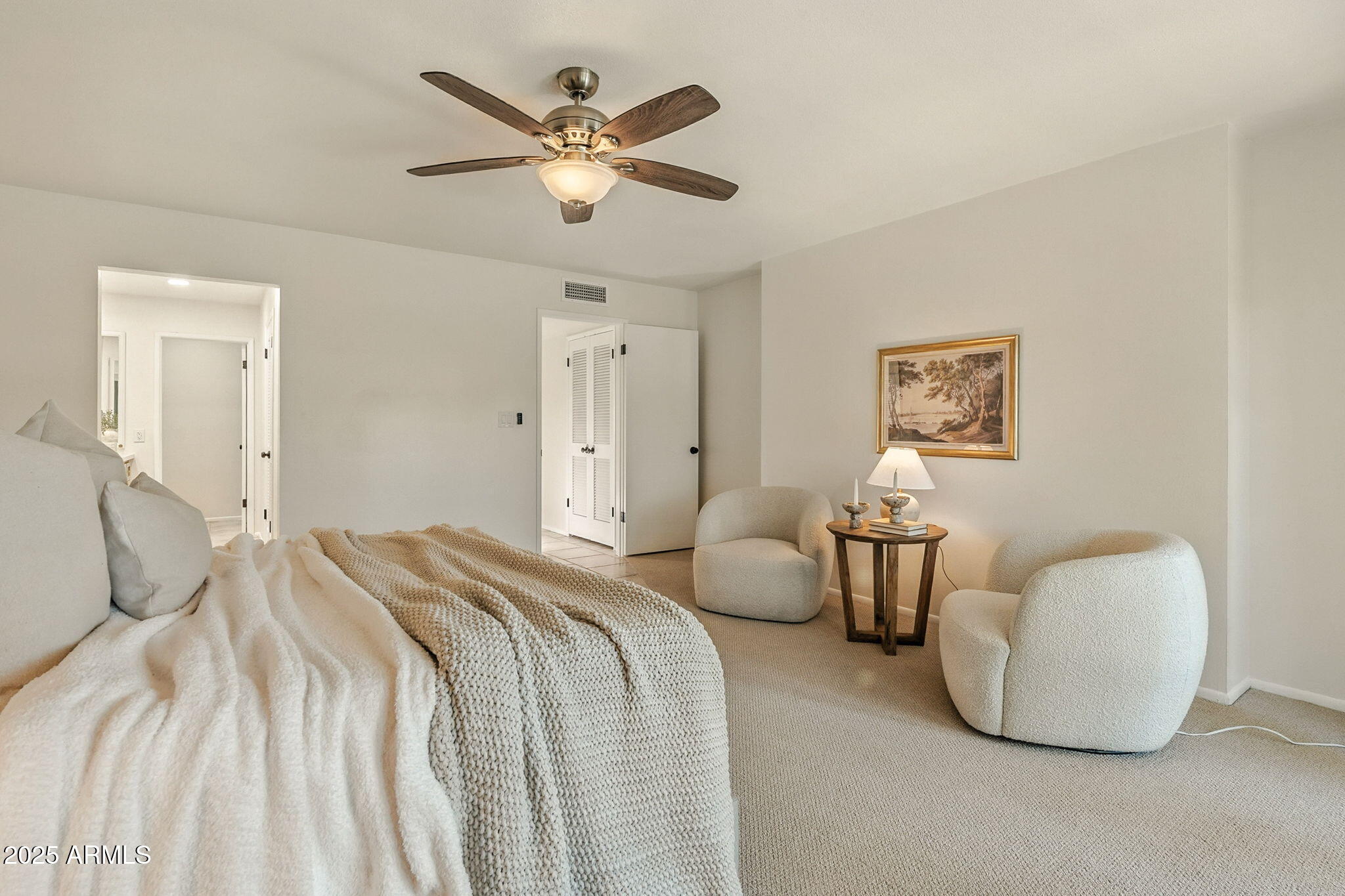 43 East Boca Raton Road Phoenix, AZ 85022 - Photo 34 of 99 a spacious bedroom with a bed and a chandelier