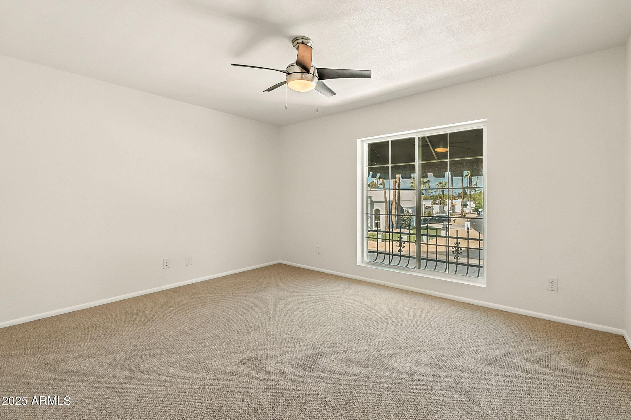 43 East Boca Raton Road Phoenix, AZ 85022 - Photo 47 of 99 an empty room with windows and ceiling fan