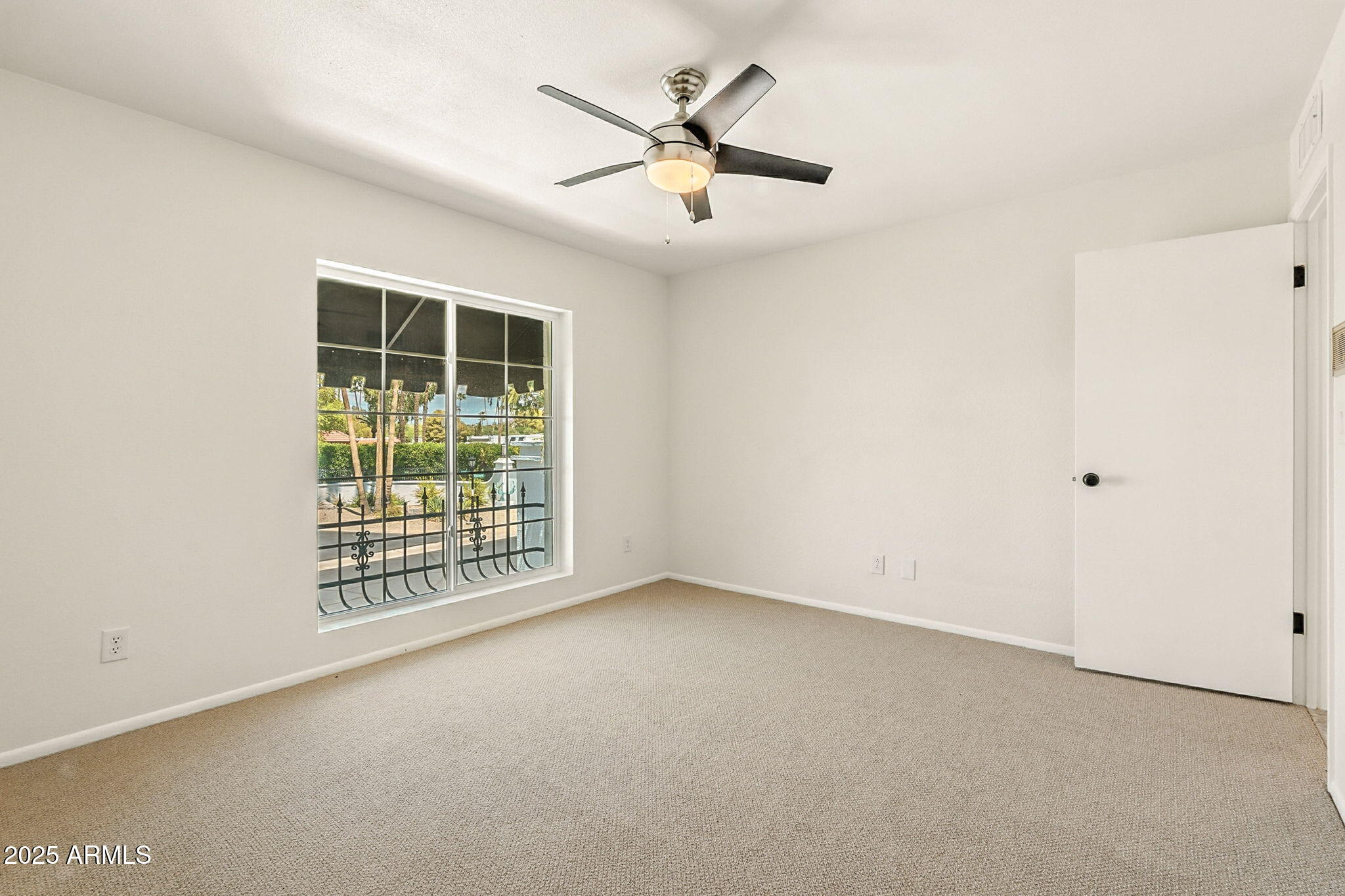 43 East Boca Raton Road Phoenix, AZ 85022 - Photo 50 of 99 an empty room with windows and fan