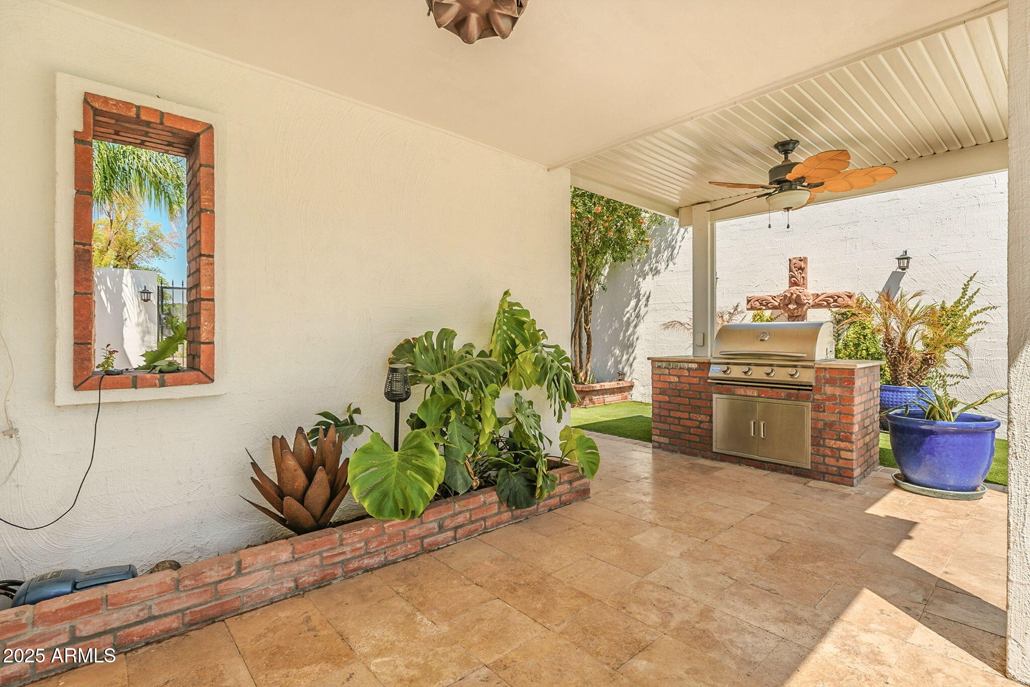 43 East Boca Raton Road Phoenix, AZ 85022 - Photo 63 of 99 a living room with a couch and potted plant