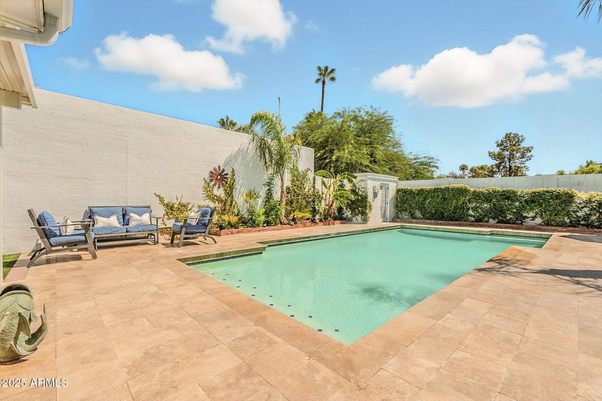 43 East Boca Raton Road Phoenix, AZ 85022 - Photo 79 of 99 a view of a swimming pool and trees in the background