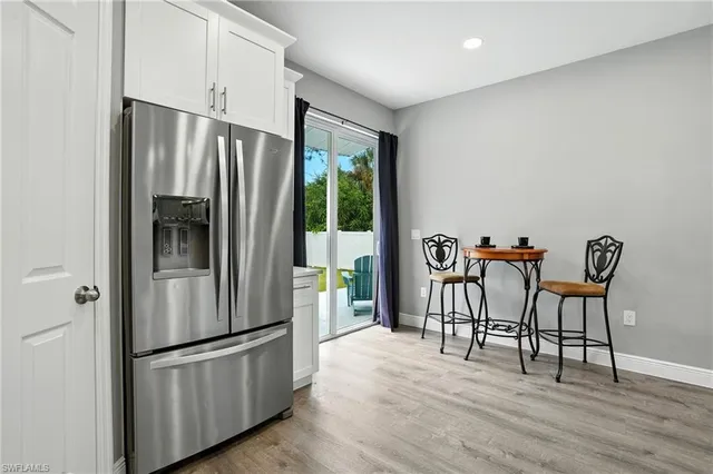 a kitchen with a stove a sink and a refrigerator