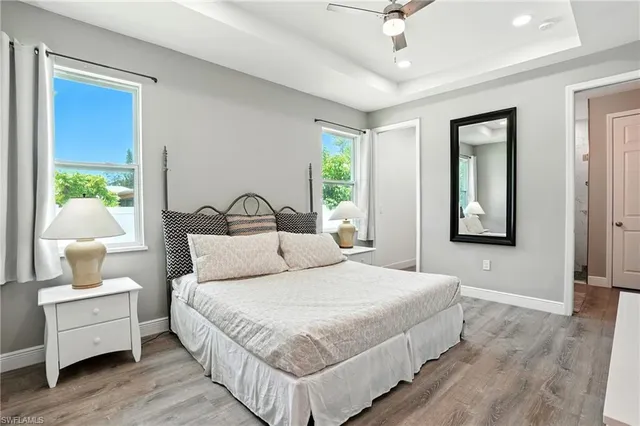 a kitchen with stainless steel appliances a refrigerator and wooden floor