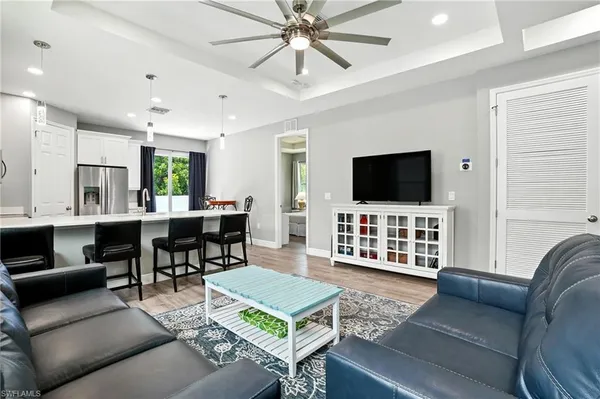 a living room with furniture and a flat screen tv