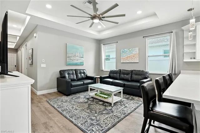 a living room with furniture and a rug