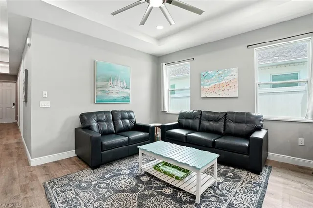 a living room with furniture and a window