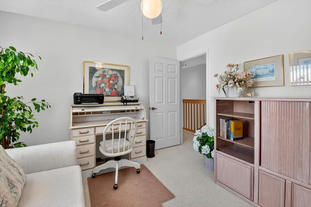 an aerial view of residential houses with outdoor space and street view