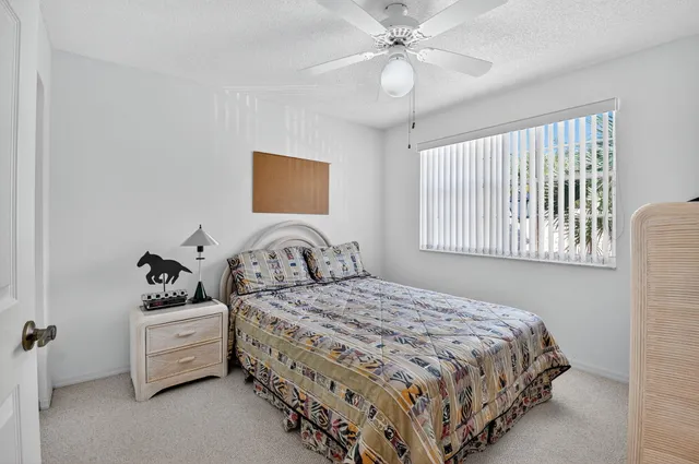 an aerial view of a house with a garden and swimming pool
