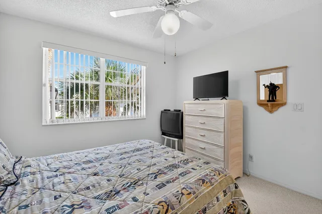 an aerial view of a house with a garden and swimming pool
