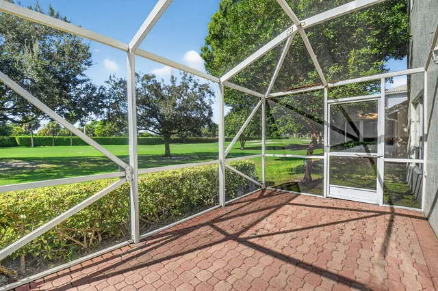 an aerial view of a house with outdoor space and lake view