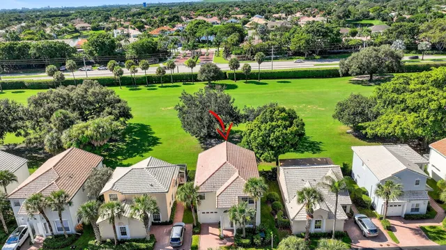 an aerial view of a house with a swimming pool yard and outdoor seating