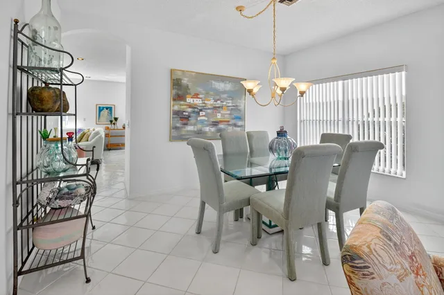 a living room with furniture potted plant and a window