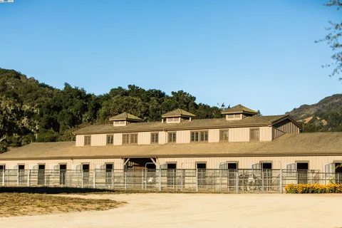 a front view of residential houses with yard