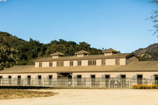 a front view of residential houses with yard