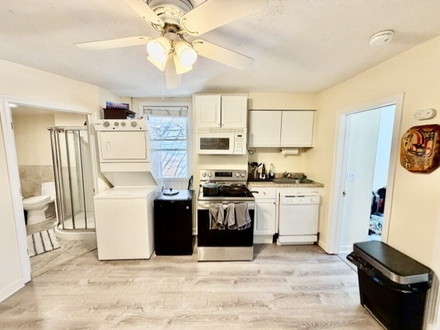 14 Cleveland Place, Unit 2 Boston, MA 02113 - Photo 3 of 18 a kitchen with stainless steel appliances kitchen island granite countertop a refrigerator a stove top oven a sink and dishwasher
