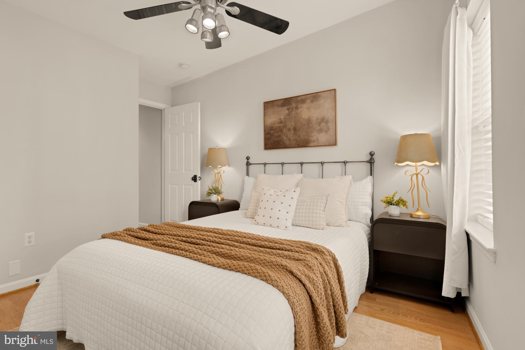 545 Gittings Street Baltimore, MD 21230 - Photo 12 of 40 a bedroom with a bed and a chandelier